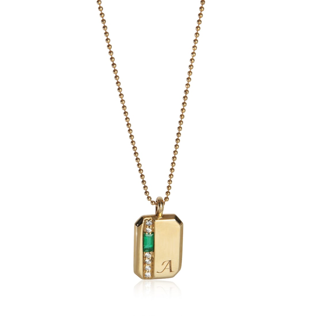 Mini Tag Pendant in 14K Yellow Gold with Emerald Diamond Accents and Initial A: Mini Tag Pendant in 14K Yellow Gold with Emerald Diamond Accents and Initial A This pre-owned mini tag pendant features an initial 'A' design crafted in 14K yellow gold. The pendant is accented with a