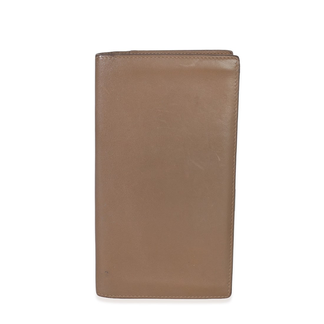 Swift Leather MC2 Fleming Wallet by Hermes in Taupe: Swift Leather MC2 Fleming Wallet by Hermes in Taupe This Hermes vintage MC2 Fleming wallet is crafted from taupe Swift leather, featuring a flap top closure. The exterior showcases a blend of brown an