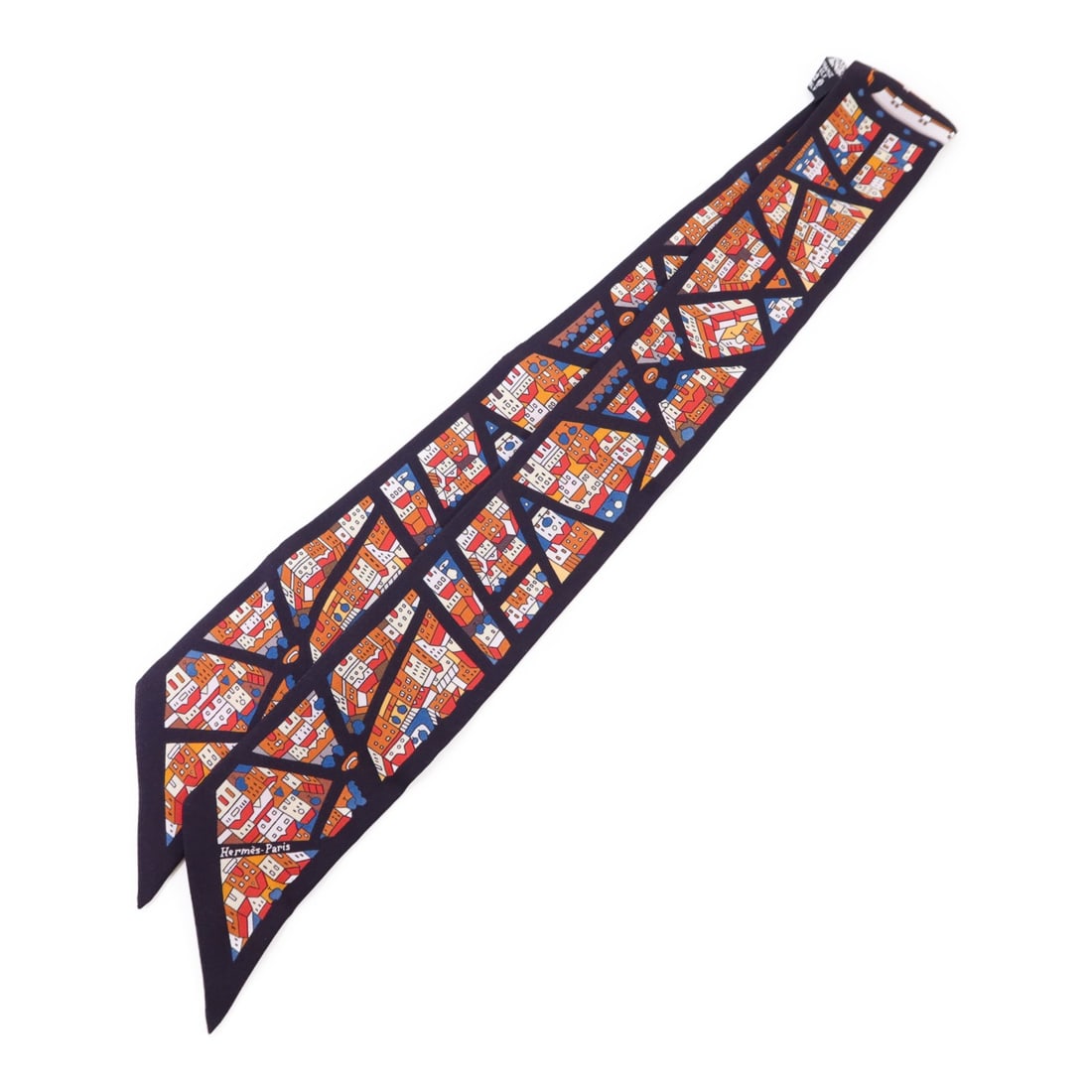 Silk Twilly Multicolor Scarf by Hermes France: Silk Twilly Multicolor Scarf by Hermes France This Hermes Twilly scarf is crafted from multicolor silk and features a vibrant design. Made in France, it is a stylish accessory suitable for regular siz