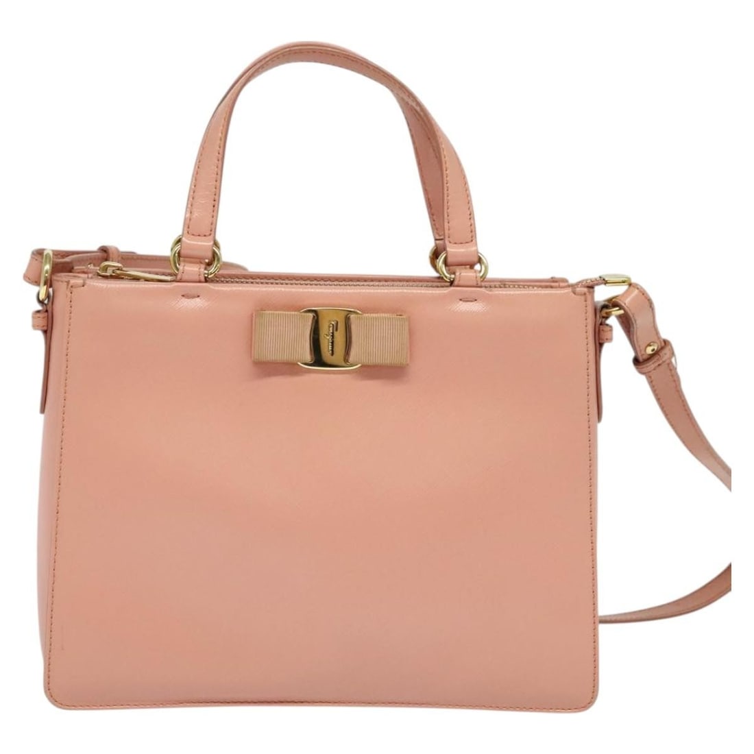 Pink Leather Vala Shoulder Bag by Salvatore Ferragamo: Pink Leather Vala Shoulder Bag by Salvatore Ferragamo This Salvatore Ferragamo Vala Shoulder Bag for women features a pink leather exterior and is crafted in Italy. The bag shows signs of use includin