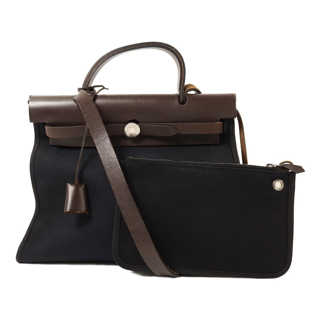 Herbag PM Black Canvas Shoulder Bag with Palladium Hardware by Hermes: Herbag PM Black Canvas Shoulder Bag with Palladium Hardware by Hermes This Hermes Herbag PM is a versatile 2-way shoulder bag crafted from black canvas. Made in France, it features a classic and funct