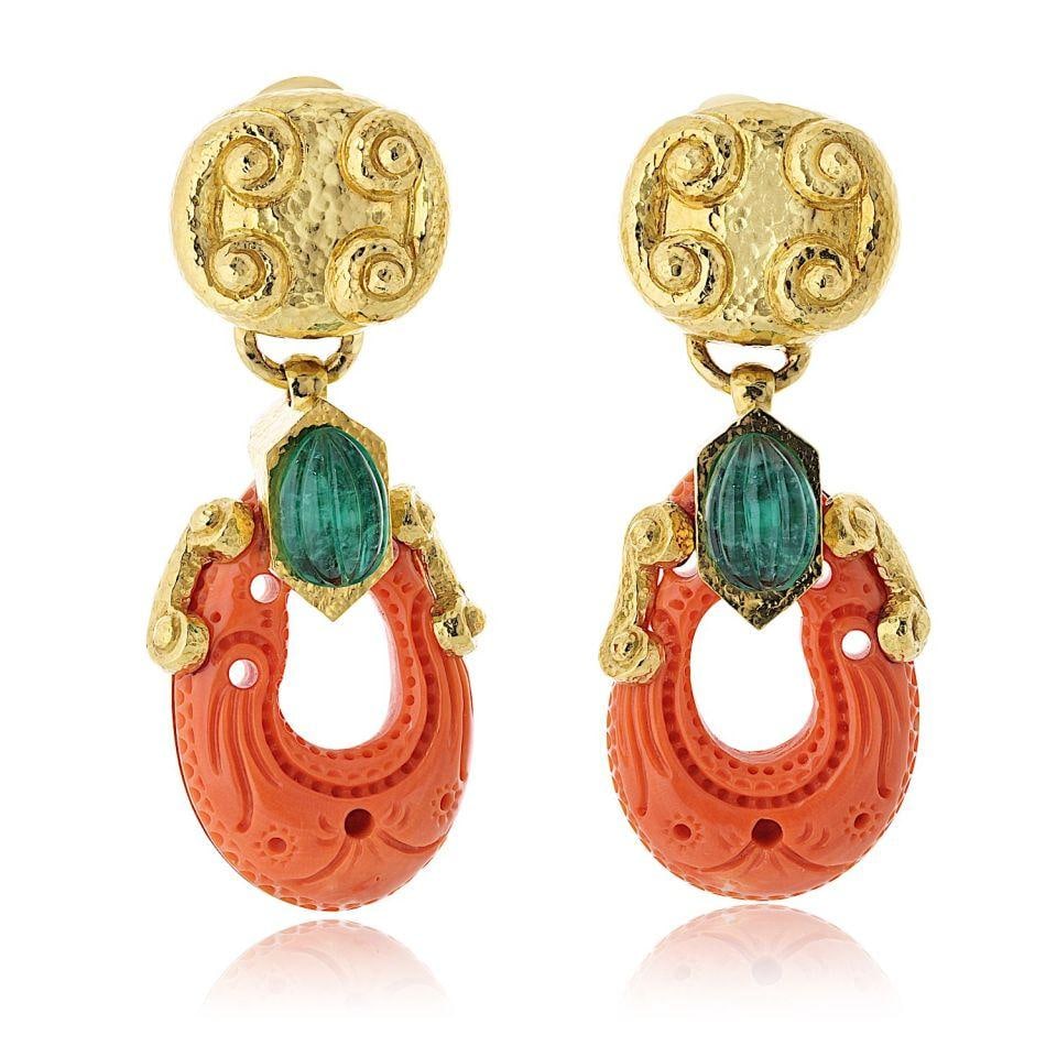 David Webb 18K Yellow Gold Coral Emerald Drop Earrings: David Webb 18K Yellow Gold Coral Emerald Drop Earrings These stunning David Webb drop earrings feature a captivating design crafted from 18K yellow gold, showcasing exquisite coral and emerald accents