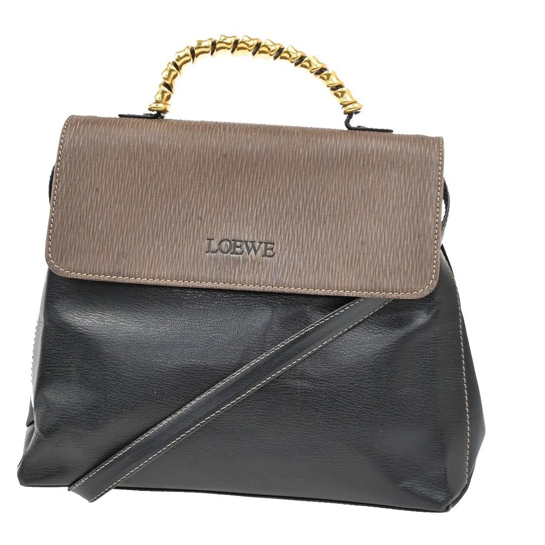 Vintage Loewe Velazquez Leather Top Handle Bag Black: Vintage Loewe Velazquez Leather Top Handle Bag Black This vintage Loewe Velazquez top handle bag features black leather construction designed for women. It offers a classic top handle style with a det