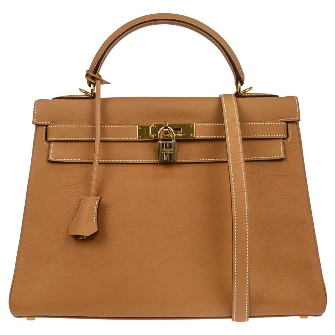 Kelly 32 Retourne 2way Leather Top Handle Bag by Hermes: Kelly 32 Retourne 2way Leather Top Handle Bag by Hermes This Hermes Kelly 32 Retourne 2-way handbag features natural Epsom leather in a brown exterior. The medium-sized bag is designed with a top hand