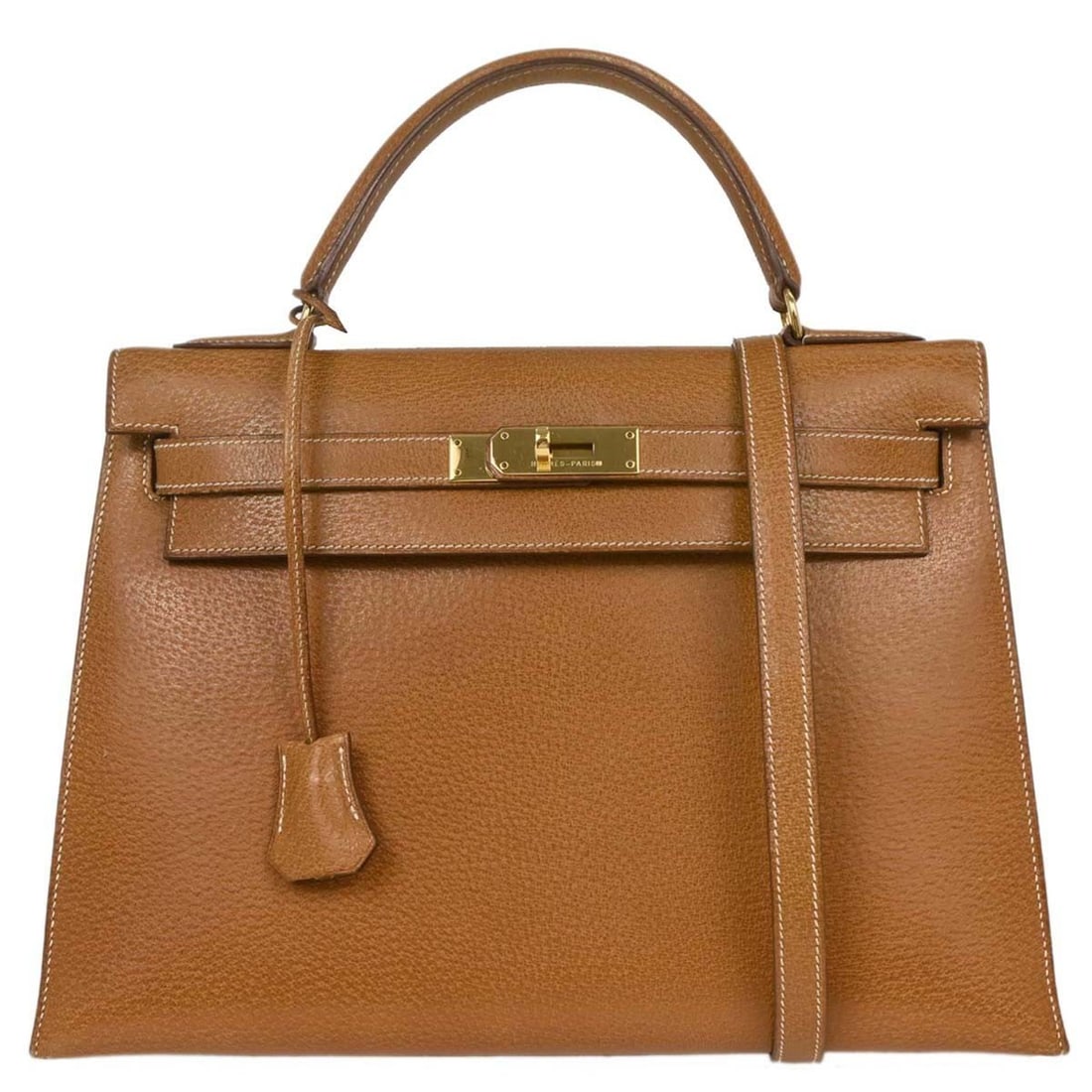 Hermes Brown Peau Porc Leather Kelly Handbag 33cm: Hermes Brown Peau Porc Leather Kelly Handbag 33cm This Hermes Kelly handbag in brown leather is designed for women. It measures 33cm x 24cm x 12cm and features signature craftsmanship from France. The