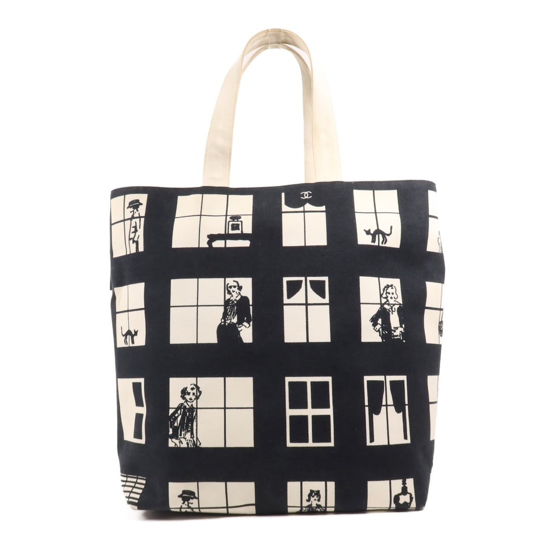 CHANEL Black Beige Canvas Tote Bag with Gold Hardware: CHANEL Black Beige Canvas Tote Bag with Gold Hardware This elegant CHANEL tote bag features a classic design in a chic black and beige color scheme. Crafted from durable canvas, it offers a stylish ye