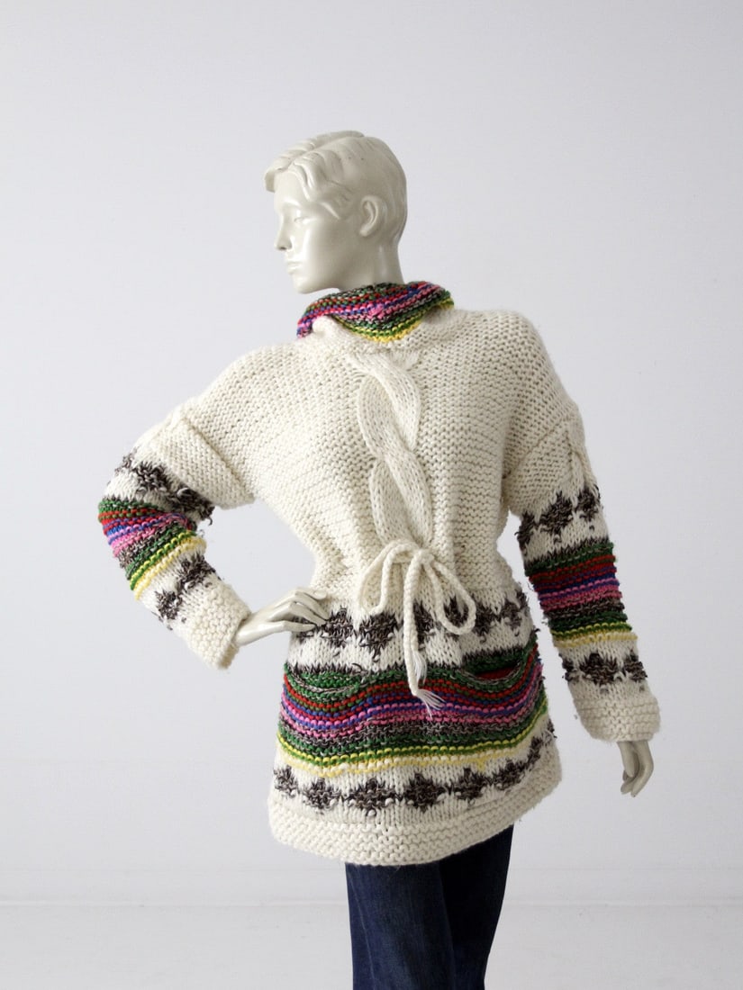 1970s Hewlett Mills Chunky Knit Hooded Sweater Cream Rainbow: 1970s Hewlett Mills Chunky Knit Hooded Sweater Cream Rainbow This stunning 1970s vintage chunky knit hooded sweater from Hewlett Mills is a unique addition to any wardrobe. Crafted from cream acrylic,