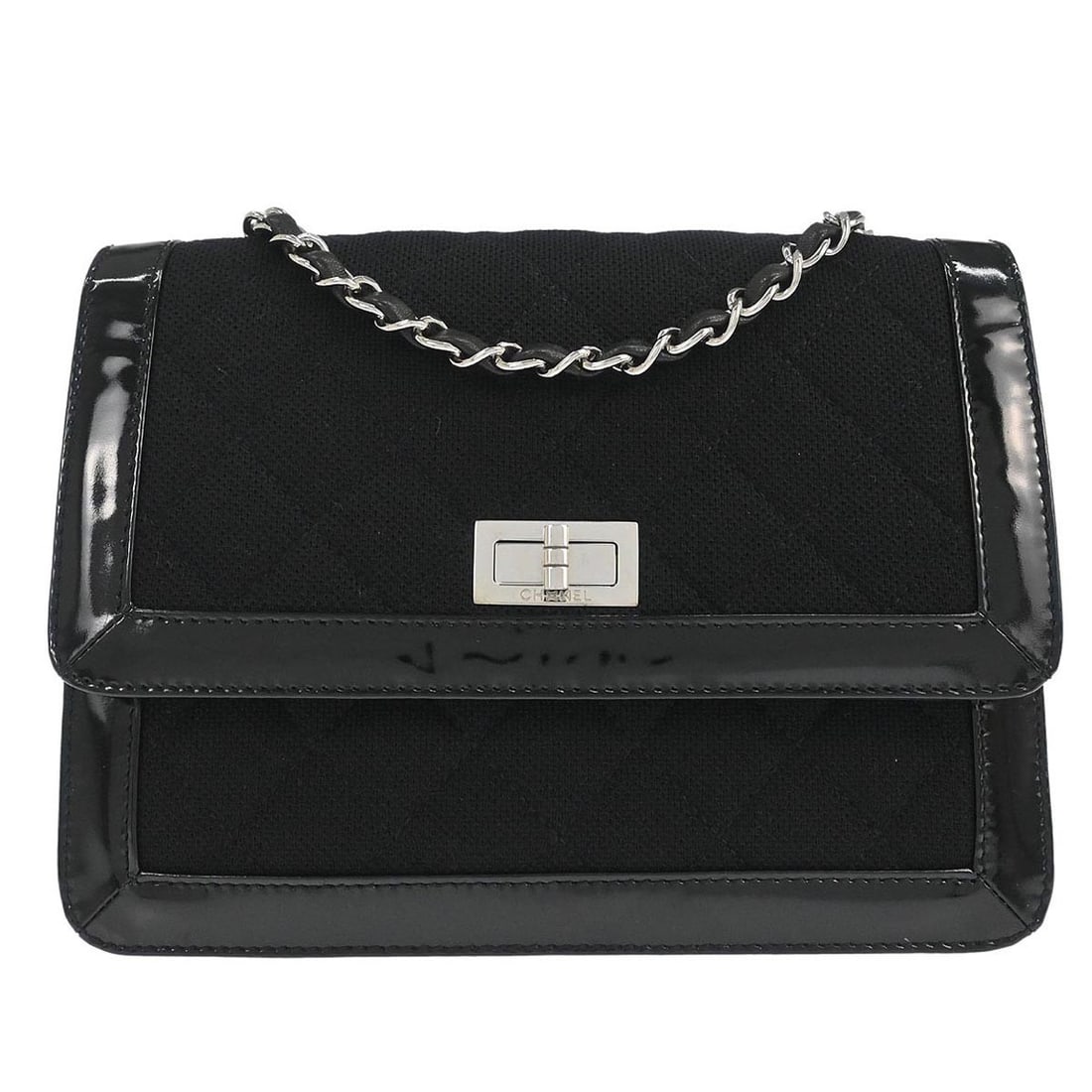 Chanel Mademoiselle Lock Black Canvas and Patent Leather Shoulder Bag: Chanel Mademoiselle Lock Black Canvas and Patent Leather Shoulder Bag This Chanel Mademoiselle Lock shoulder bag features black canvas with patent leather accents. It is designed with a medium-sized s