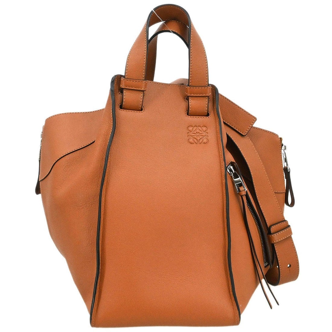 Loewe Hammock Medium Brown Leather Two Way Tote Bag: Loewe Hammock Medium Brown Leather Two Way Tote Bag This Loewe Hammock 2-way tote handbag features a brown leather exterior and double leather handles. It has a medium size with inner pockets for orga