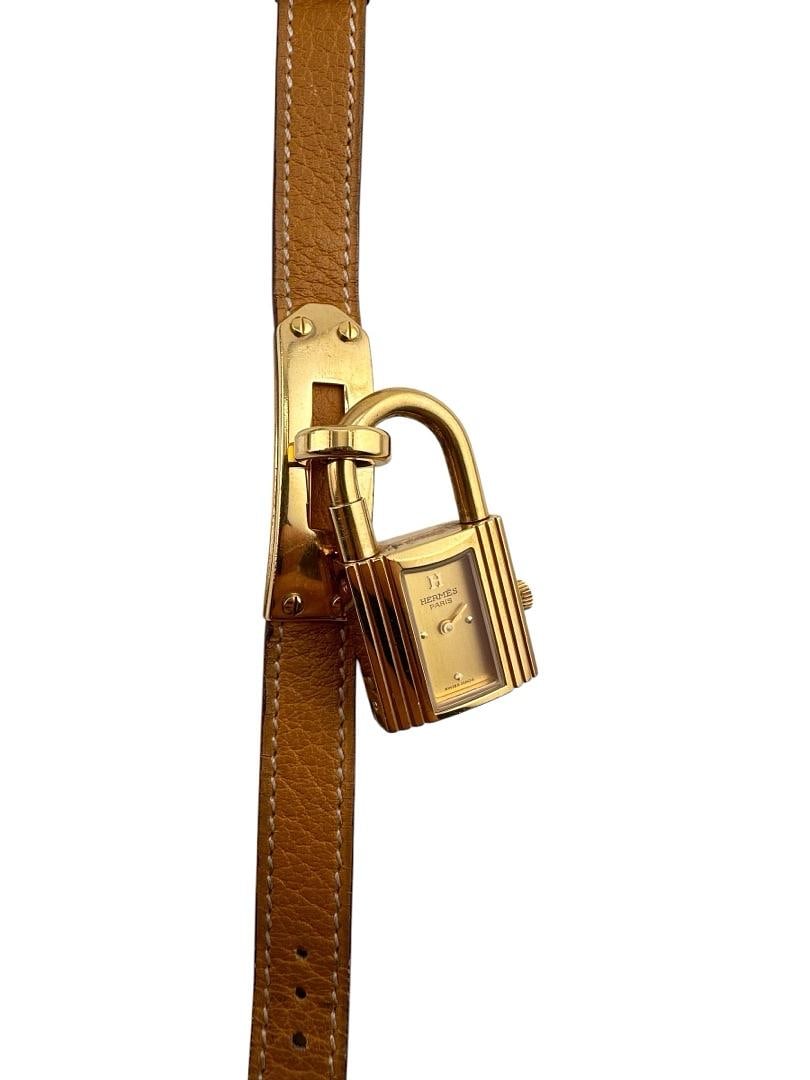 Hermes Kelly Clad On Stainless Gold Dial Ladies Watch KE1.201 on Leather: Hermes Kelly Clad On Stainless Gold Dial Ladies Watch KE1.201 on Leather This Hermes Kelly Clad On Ss watch features a gold dial and a leather bracelet. Designed specifically for women, it carries the