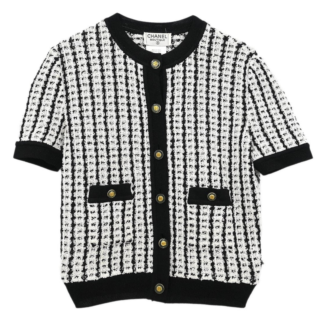 Chanel Vintage White Short Sleeve Jacket Size 42 Collarless: Chanel Vintage White Short Sleeve Jacket Size 42 Collarless This vintage Chanel short sleeve top is a stylish addition to your casual wardrobe. Made from a blend of 74% polyester, 24% acetate, and 2%