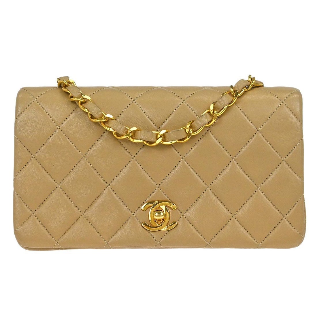 Mini Beige Lambskin Shoulder Bag Chanel Turn Lock Flap: Mini Beige Lambskin Shoulder Bag Chanel Turn Lock Flap This Chanel mini full flap shoulder bag features beige lambskin leather with a classic turn lock closure. Designed with a shoulder strap, it offe