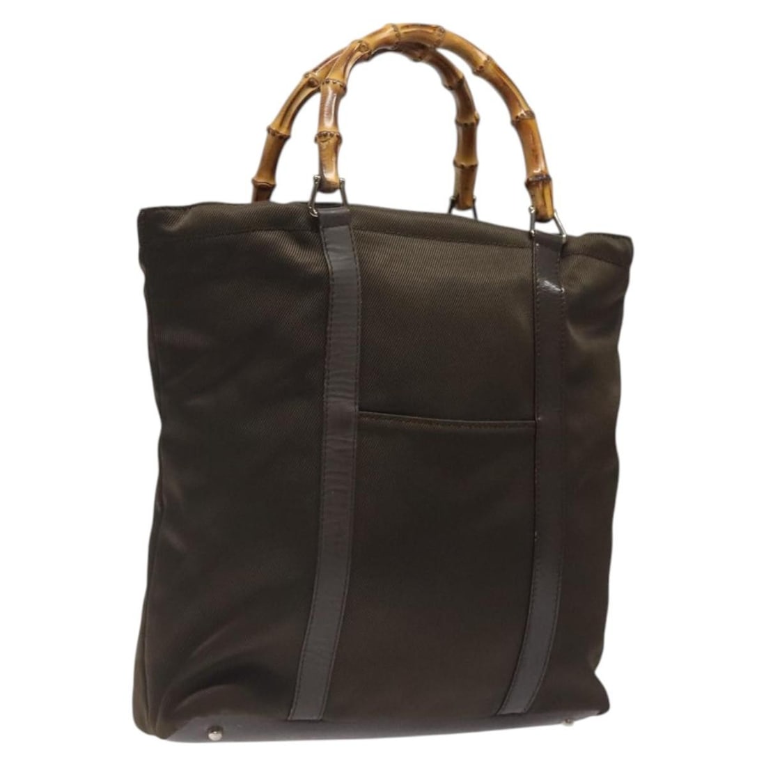 Brown Nylon Tote Bag with Bamboo Handles by Gucci: Brown Nylon Tote Bag with Bamboo Handles by Gucci This Gucci Vintage Bamboo Handle Tote features a brown nylon exterior complemented by signature bamboo handles. The tote is designed for women and sho
