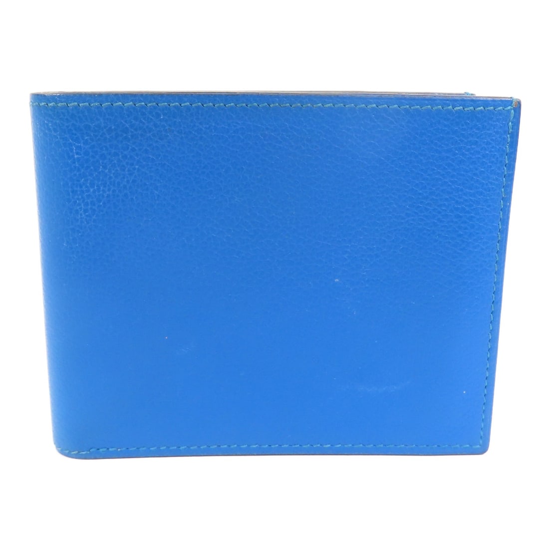 Hermes Citizen Twill Evercolor Calfskin Bi-Fold Blue Short Compact Wallet: Hermes Citizen Twill Evercolor Calfskin Bi-Fold Blue Short Compact Wallet The Hermes Citizen Twill Compact Wallet is crafted from Evercolor calfskin leather in a striking blue hue. Designed as a bi-fo