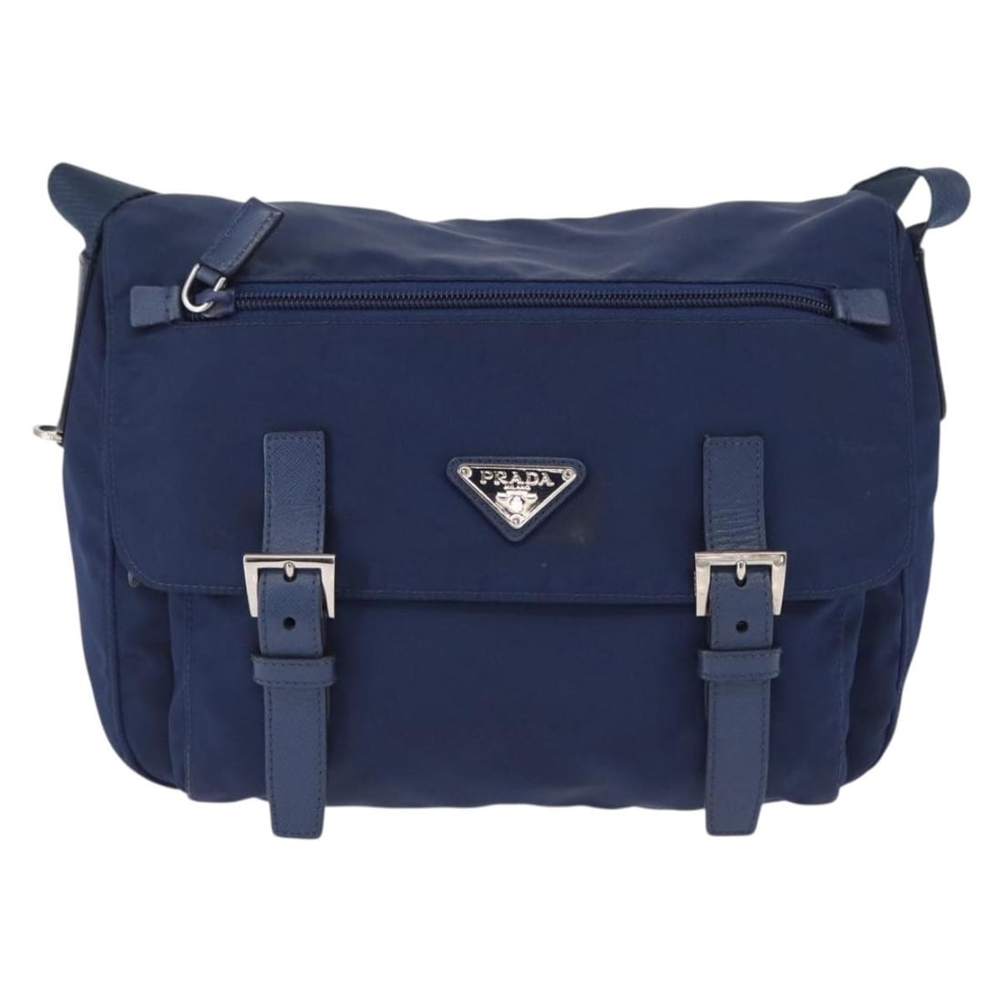 Prada Tessuto Navy Nylon Double Buckle Messenger Bag Unisex: Prada Tessuto Navy Nylon Double Buckle Messenger Bag Unisex This Prada Double Buckle Flap Messenger Bag is crafted from durable navy nylon and features a practical, unisex design. The bag includes a f
