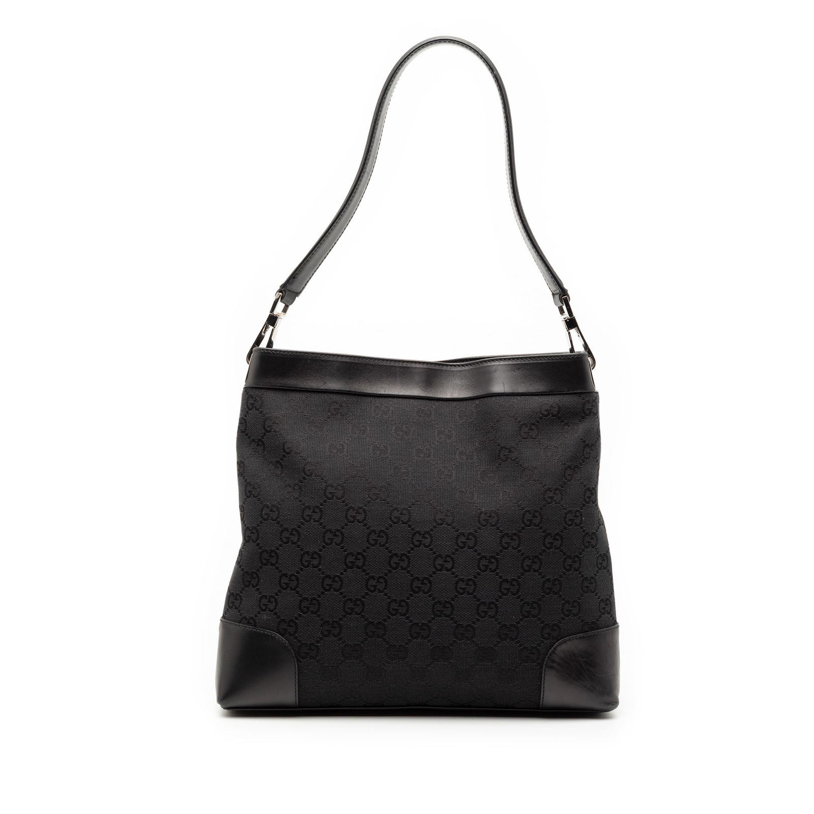 Black Gucci GG Canvas Bag with Leather Trim and Magnetic Closure: Black Gucci GG Canvas Bag with Leather Trim and Magnetic Closure This Gucci GG Canvas Shoulder Bag features a black canvas body with leather trim, a flat leather strap, an open top with a magnetic sna