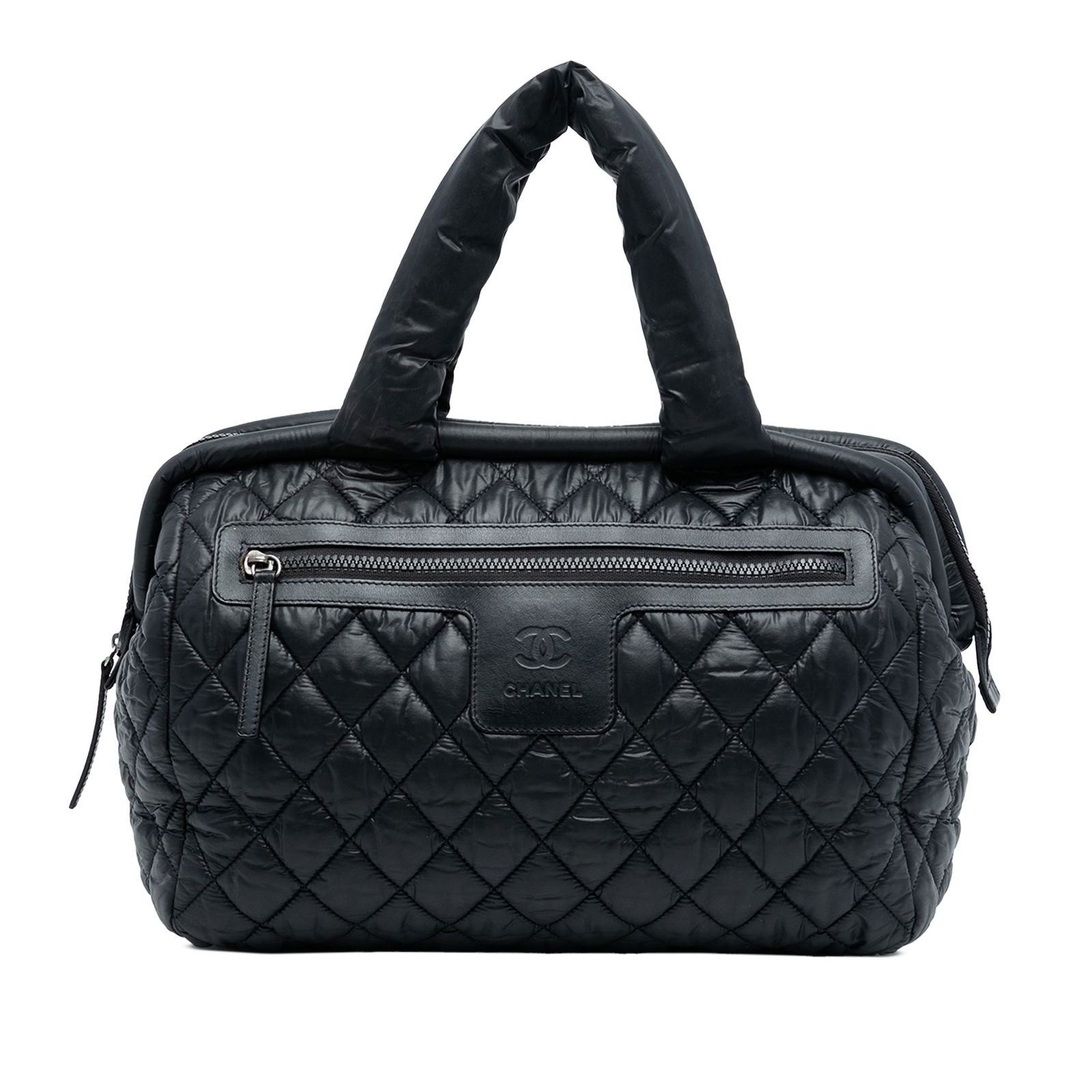 Black Chanel Coco Cocoon Bowler Quilted Nylon Handbag with Top Zip: Black Chanel Coco Cocoon Bowler Quilted Nylon Handbag with Top Zip This Chanel Coco Cocoon Bowler Bag features a quilted nylon exterior in black, rolled handles, a top zip closure, a front exterior zi