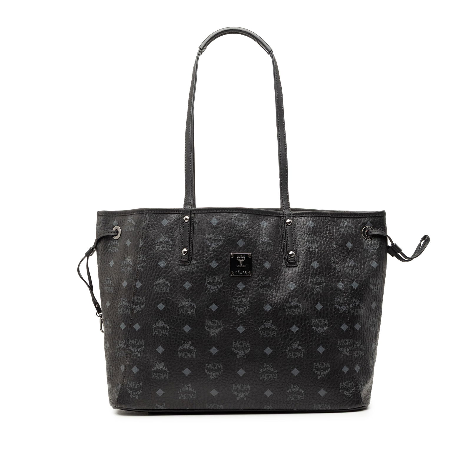 MCM Visetos Black Coated Canvas Tote with Leather Trim and Drawstring Sides: MCM Visetos Black Coated Canvas Tote with Leather Trim and Drawstring Sides This MCM Visetos tote bag features a printed coated canvas body with leather trim, flat leather straps, an open top, and sid
