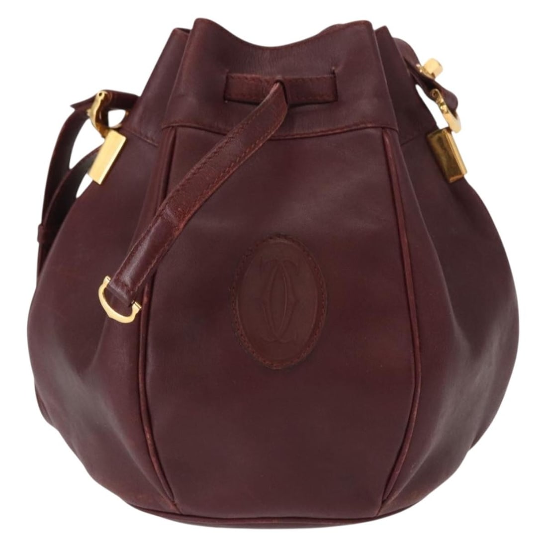 Must de Cartier burgundy leather shoulder bag for women: Must de Cartier burgundy leather shoulder bag for women This pre-owned Must de Cartier shoulder bag is crafted from burgundy leather and designed for women. It features a classic silhouette with a spa