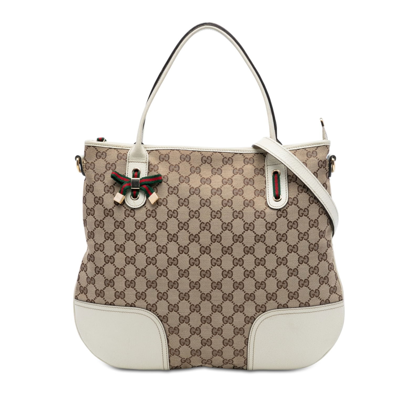 Brown GG Canvas Princy Satchel by Gucci with Leather Trim: Brown GG Canvas Princy Satchel by Gucci with Leather Trim The Gucci GG Canvas Princy Satchel features a canvas body with leather trim, flat leather handles, and a detachable flat leather strap. It is
