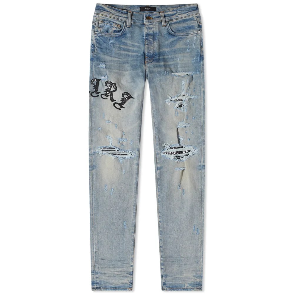 Old English Logo Denim Jeans by Amiri Size 38: Old English Logo Denim Jeans by Amiri Size 38 Authentic Amiri Old English Logo Jeans in un-used and unworn condition. Features the signature Old English logo design and comes in size 38. Specification