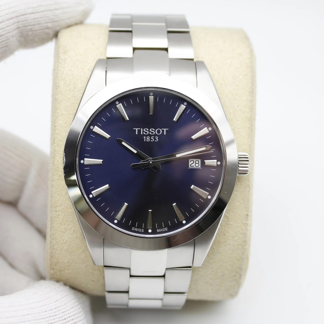 Tissot Gentleman 40mm Blue Sunburst Dial Quartz Watch T1274101104100: Tissot Gentleman 40mm Blue Sunburst Dial Quartz Watch T1274101104100 This Tissot Gentleman wristwatch features a striking blue sunburst dial, elegantly complemented by stick indices and a fixed gray b