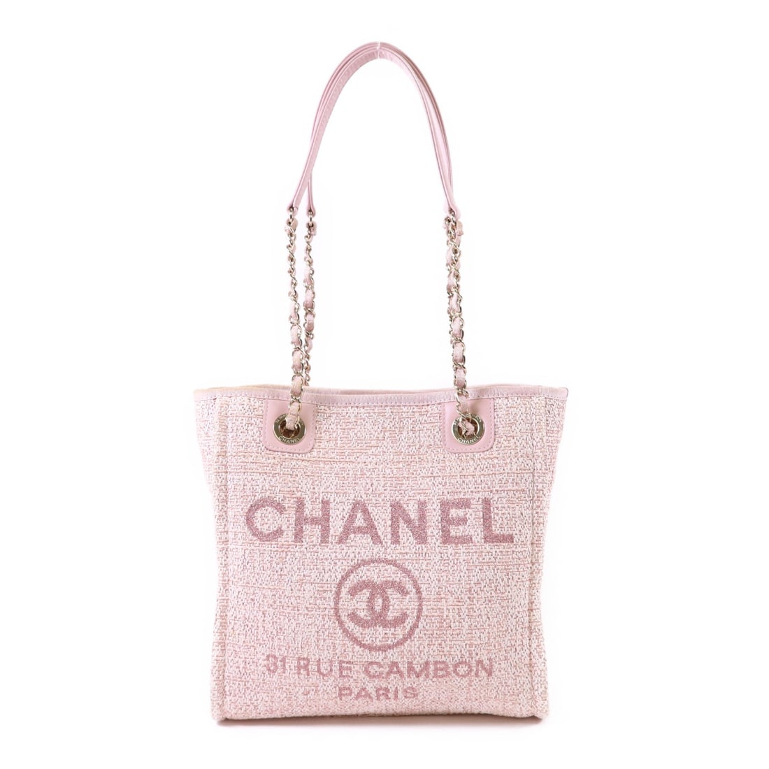 Pink Canvas Tote with Gold Tone Hardware by CHANEL: Pink Canvas Tote with Gold Tone Hardware by CHANEL This CHANEL tote bag is crafted from pink canvas and features a classic tote silhouette. Made in France, it offers a spacious interior and is designe