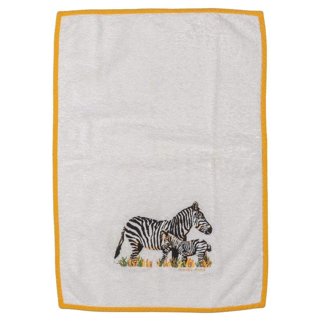 Hermes Vintage Cotton Terry Towel with Embroidered Zebra Design: Hermes Vintage Cotton Terry Towel with Embroidered Zebra Design This exquisite vintage towel from Hermes is crafted from soft white cotton terry cloth, featuring a vibrant yellow trim. The standout fe