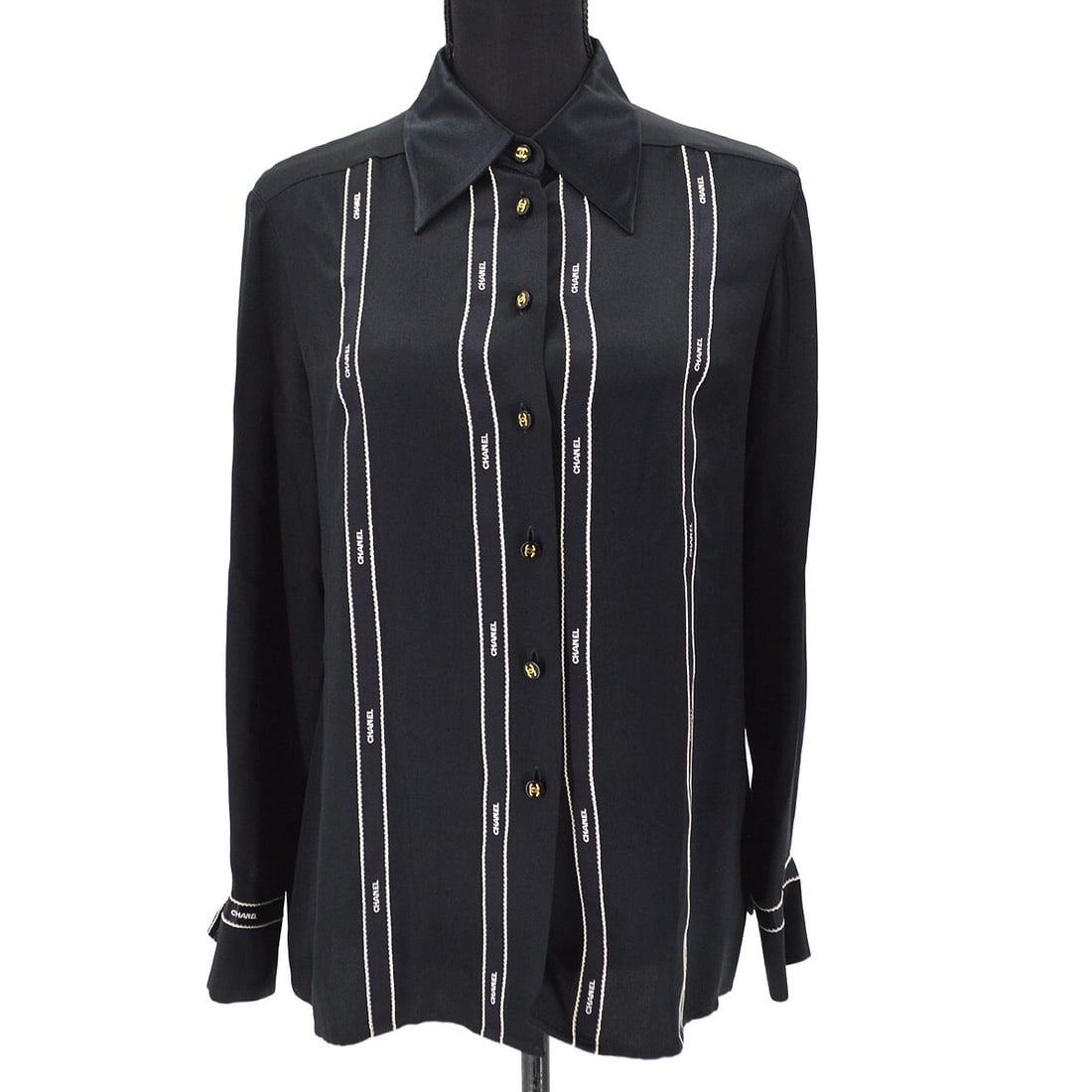 Chanel Vintage Black Silk Blouse Shirt Long Sleeve Size 40: Chanel Vintage Black Silk Blouse Shirt Long Sleeve Size 40 This elegant Chanel blouse is crafted from 100% silk, featuring a classic collared neckline and long sleeves, perfect for a casual occasion.