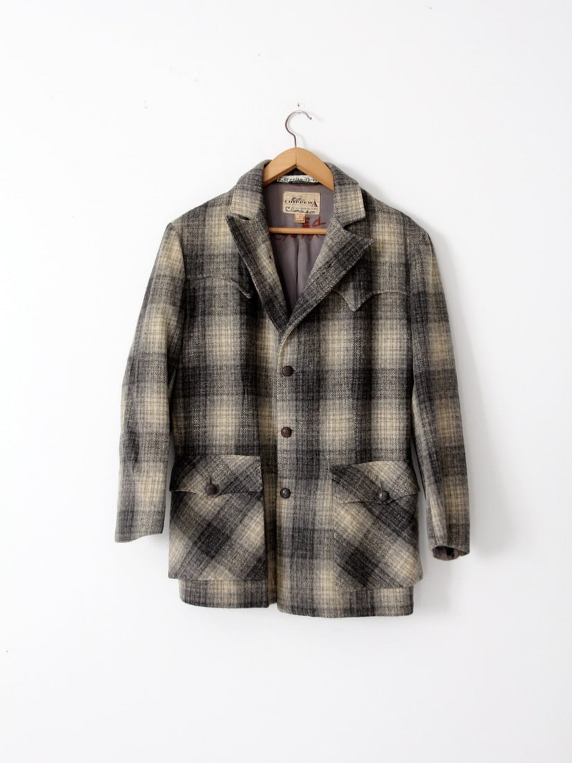 1950s Chippewa Falls Plaid Wool Coat with Leather Buttons: 1950s Chippewa Falls Plaid Wool Coat with Leather Buttons This stunning 1950s vintage wool coat from Chippewa Falls Woolen Mills showcases a striking gray shadow plaid pattern. The coat features weste