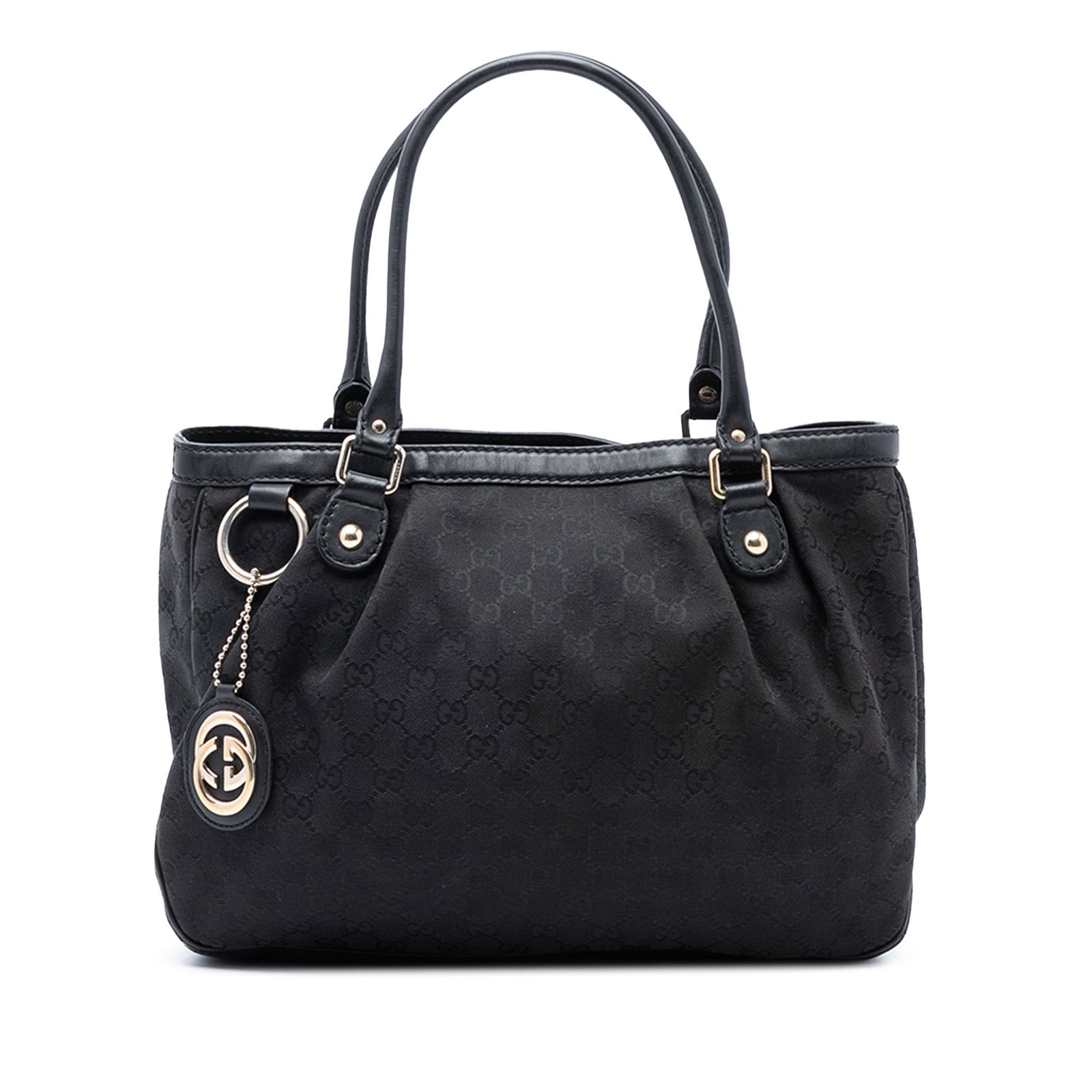 Black GG Canvas Sukey Tote Bag by Gucci with Leather Trim: Black GG Canvas Sukey Tote Bag by Gucci with Leather Trim This Gucci GG Canvas Sukey Tote features a fabric canvas body with leather trim, rolled leather handles, an open top with a magnetic snap clos