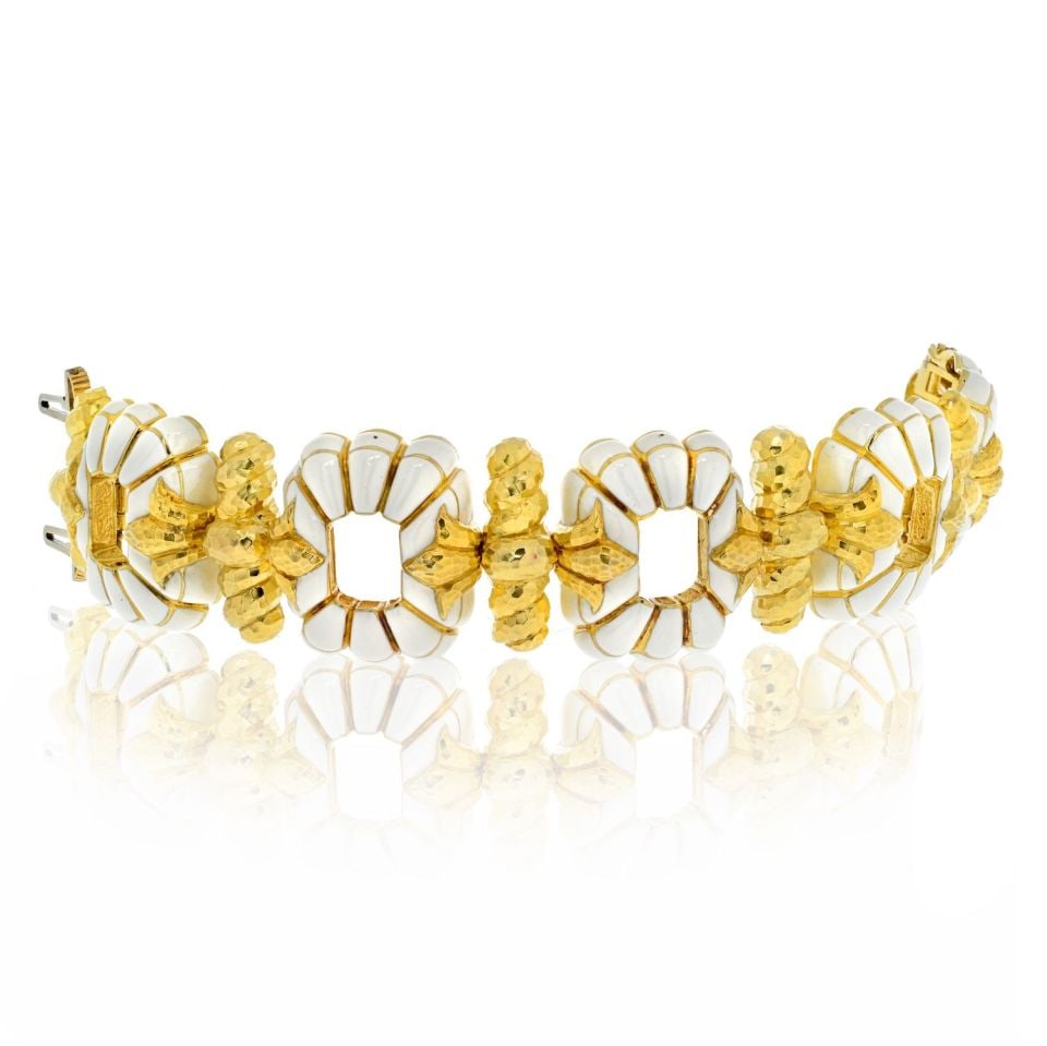David Webb Floral Motif Platinum 18K Yellow Gold Open Link Bracelet: David Webb Floral Motif Platinum 18K Yellow Gold Open Link Bracelet This exquisite David Webb bracelet showcases a stunning floral motif crafted from a combination of platinum and 18K yellow gold, acc