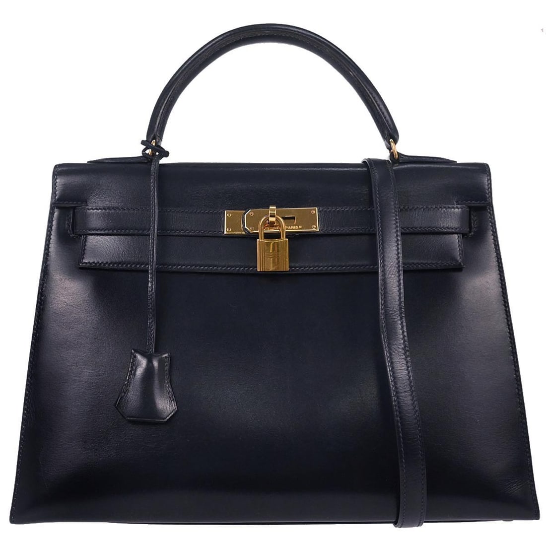 Kelly 32 Navy Leather Structured Satchel with Detachable Strap by Hermes: Kelly 32 Navy Leather Structured Satchel with Detachable Strap by Hermes This Hermes Kelly 32 Sellier handbag is crafted from navy box calf leather and features a medium-sized structured silhouette. T