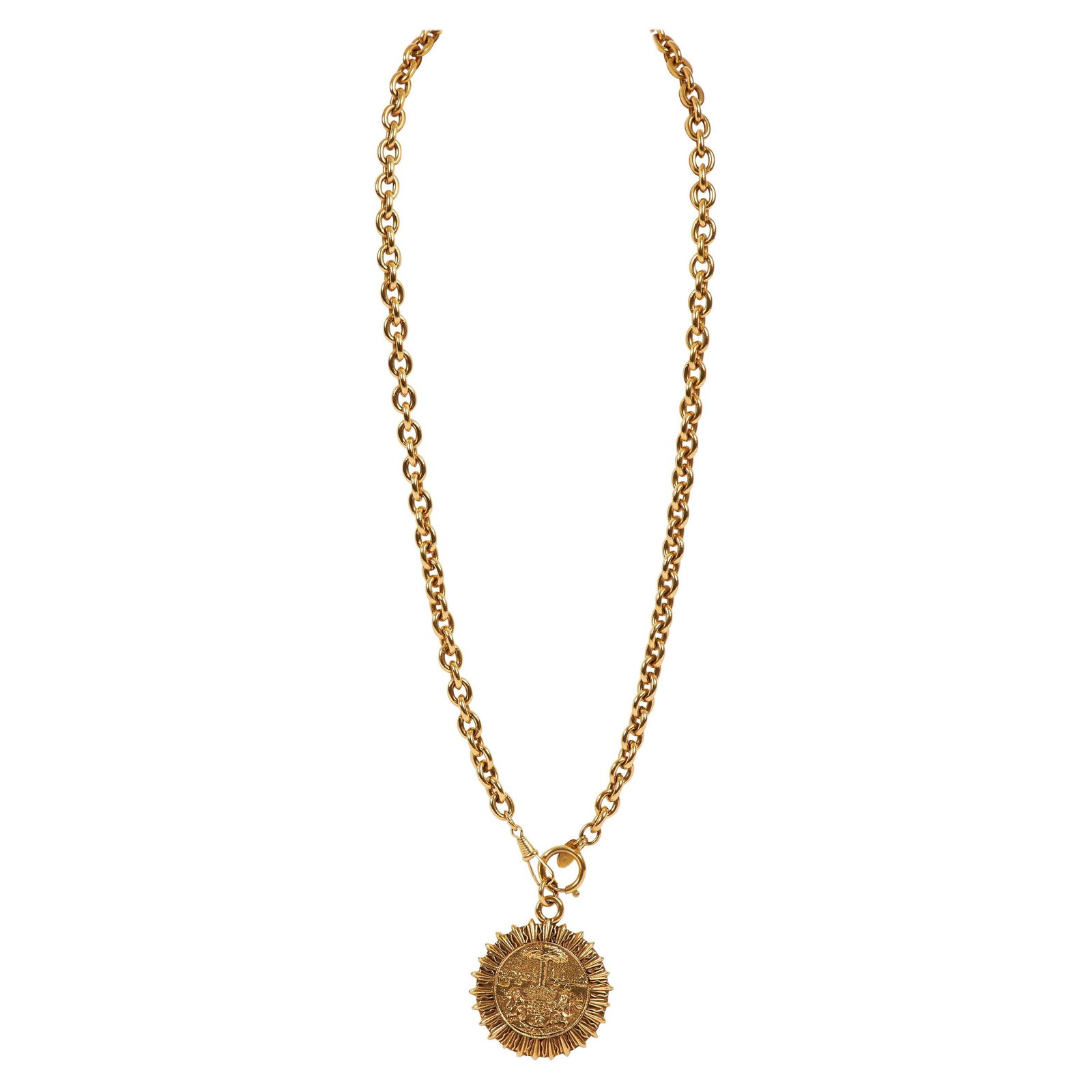 Chanel 1980s Gold Tone Sun Tarot Pendant Necklace: Chanel 1980s Gold Tone Sun Tarot Pendant Necklace This stunning Chanel Gold Sun Tarot Chain Pendant Necklace features a unique sun tarot pendant crafted in gold tone metal, embodying the iconic style