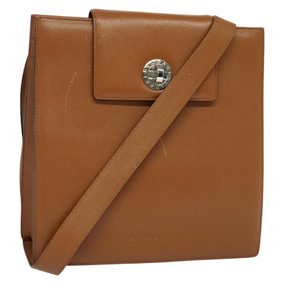 Leather Convertible Top Handle Bag by Bvlgari in Brown: Leather Convertible Top Handle Bag by Bvlgari in Brown This Bvlgari Turnlock Flap Convertible Top Handle bag is crafted from brown leather with a convertible top handle design. It features metal fitti