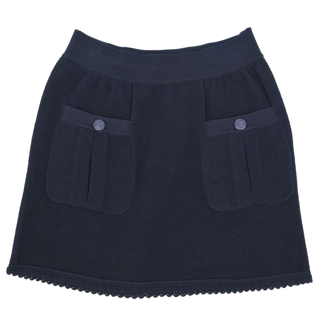 Chanel Navy Cotton Skirt P53671K06984 Size 40: Chanel Navy Cotton Skirt P53671K06984 Size 40 This stylish Chanel skirt showcases a classic navy color, perfect for casual occasions. Crafted from 100% cotton, it features a button closure and a logo