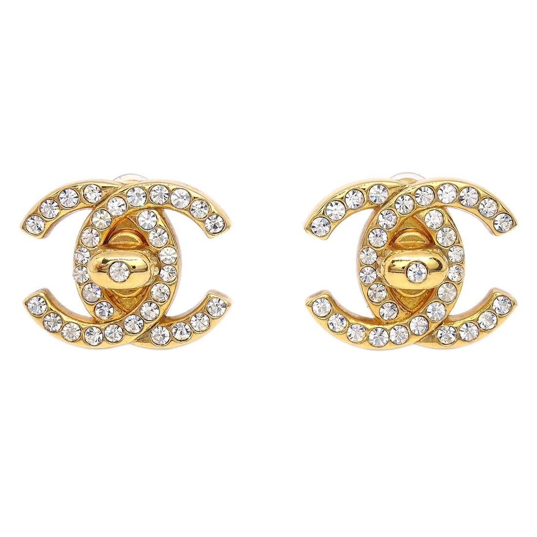 Chanel 96A Gold Plated Rhinestone Turnlock Large Clip-On Earrings: Chanel 96A Gold Plated Rhinestone Turnlock Large Clip-On Earrings These Chanel CC Turnlock clip-on earrings feature a classic turnlock design adorned with rhinestones. Crafted from gold-plated