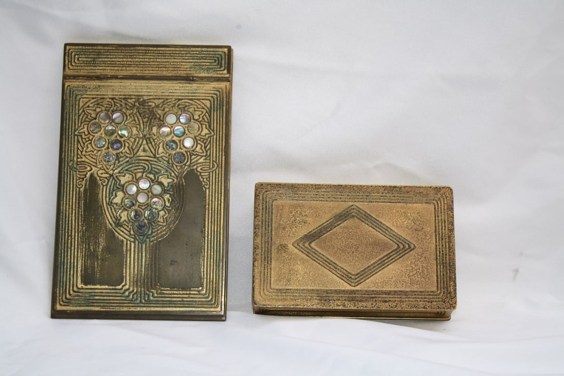 Tiffany Studios 1900s Enameled Bronze Box & Notepad Holder Set: Tiffany Studios 1900s Enameled Bronze Box & Notepad Holder Set Discover a stunning two-piece collection from the 1900s featuring Tiffany Studios. This exquisite set includes an enameled bronze box and