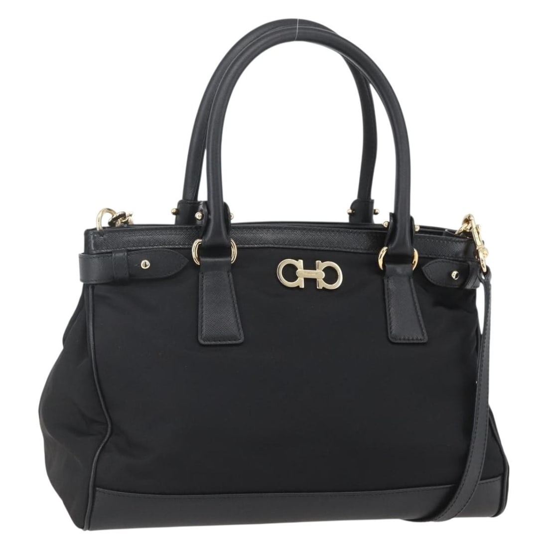Black Nylon Gancini Handbag by Salvatore Ferragamo with Leather Trim and Shoulder Strap: Black Nylon Gancini Handbag by Salvatore Ferragamo with Leather Trim and Shoulder Strap This Salvatore Ferragamo Gancini handbag is crafted from black nylon with leather accents and features a versati