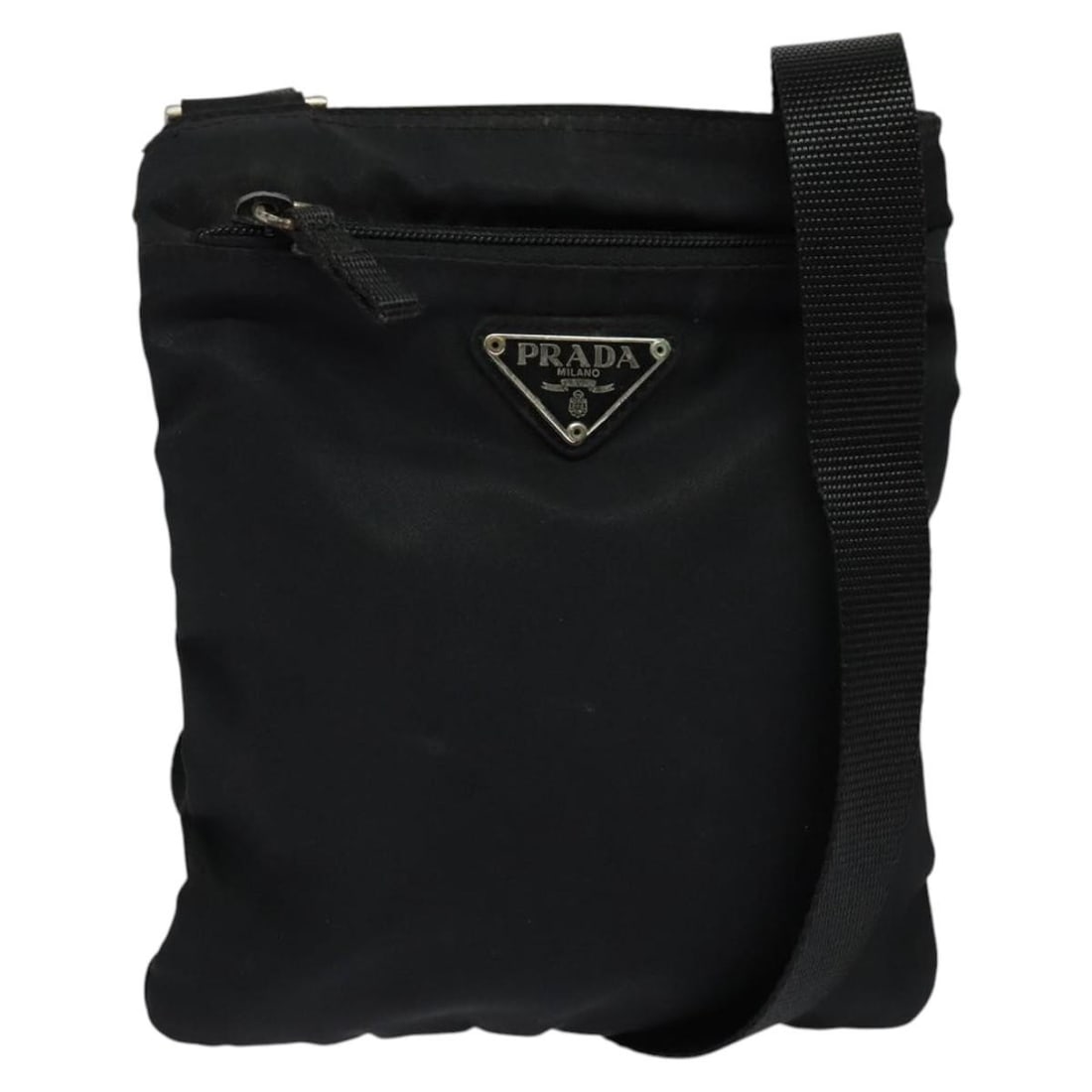 Prada Black Nylon Flat Messenger Bag for Women: Prada Black Nylon Flat Messenger Bag for Women This Prada Flat Messenger Bag features a sleek black nylon construction, designed for women. The bag shows signs of prior use, including minor rubbing, s