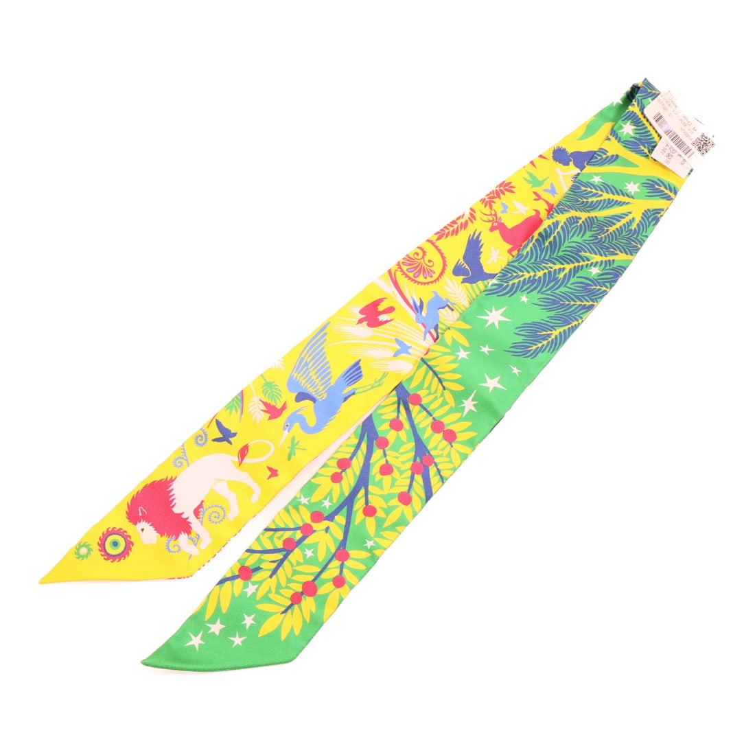 HERMES Twilly Silk Scarf in Yellow Green France: HERMES Twilly Silk Scarf in Yellow Green France This luxurious HERMES Twilly Scarf is crafted from high-quality silk, showcasing a vibrant yellow color that adds a pop of brightness to any outfit. Wit