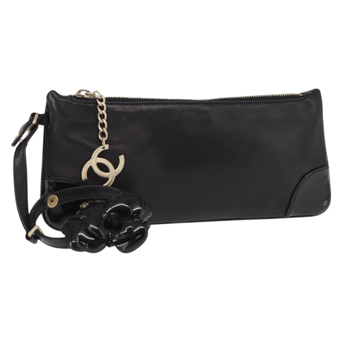 Black Leather Camellia Clutch by Chanel with Italian Craftsmanship: Black Leather Camellia Clutch by Chanel with Italian Craftsmanship This pre-owned Chanel Camellia Clutch Bag is crafted from black leather and features a sleek, compact design. The bag is designed for