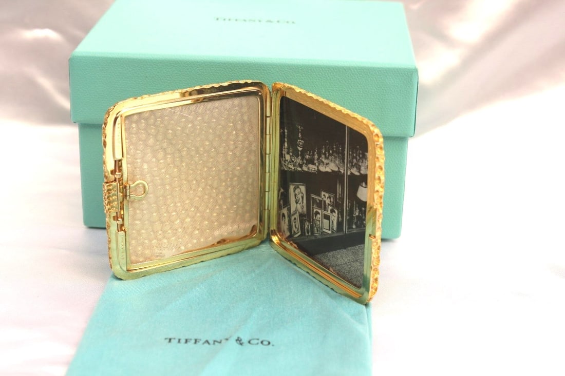 Tiffany 18k Gold Picture Frame with Original Box and Bag: Tiffany 18k Gold Picture Frame with Original Box and Bag This un-used Tiffany & Co. picture frame is crafted from 18k gold. The frame includes its original Tiffany & Co. bag and box. It weighs 135 gra