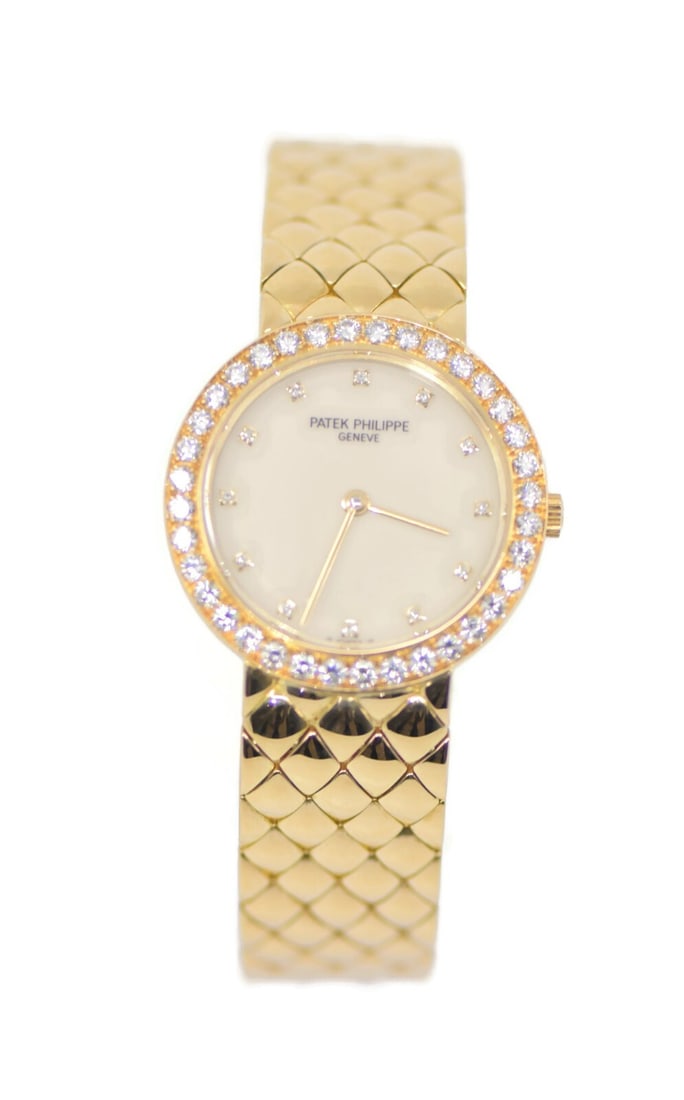 Patek Philippe Calatrava 18K Yellow Gold Diamond Watch Ref 4820J: Patek Philippe Calatrava 18K Yellow Gold Diamond Watch Ref 4820J This exquisite Patek Philippe Calatrava watch is a stunning example of luxury craftsmanship. Featuring an elegant 18K yellow gold case