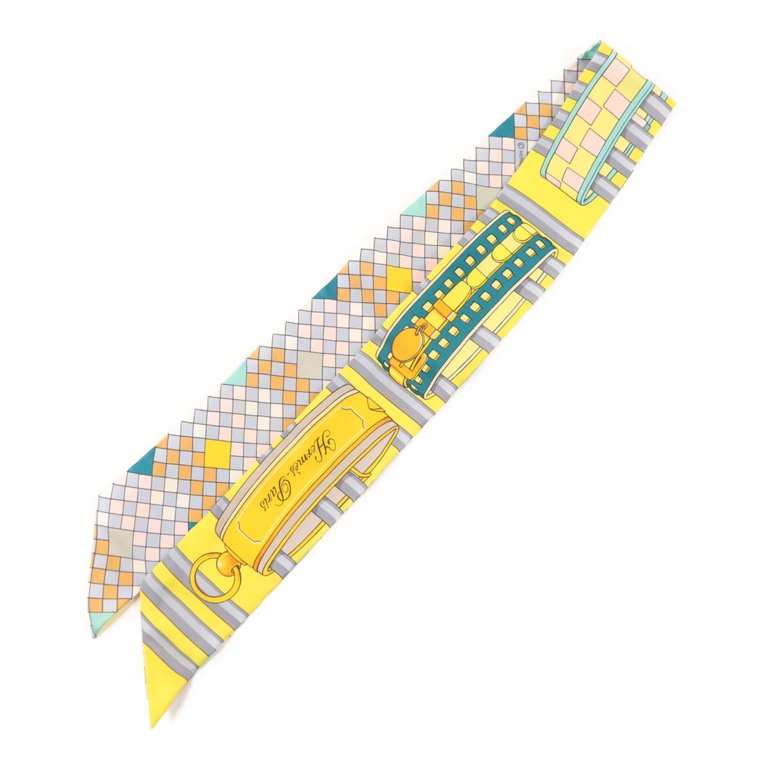 Silk Twilly Scarf by Hermes in Multicolor and Yellow: Silk Twilly Scarf by Hermes in Multicolor and Yellow This Hermes Twilly scarf is crafted from silk and features a vibrant yellow, green, and multicolor design. Made in France, it is a regular size sca