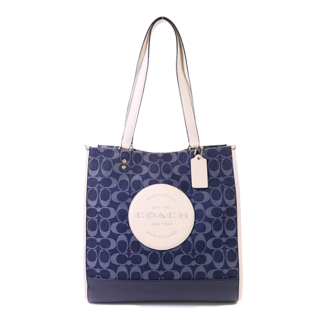 Dempsey Canvas Tote Navy Blue Bag by COACH C2823 with Gold Tone Hardware: Dempsey Canvas Tote Navy Blue Bag by COACH C2823 with Gold Tone Hardware This COACH Dempsey tote bag features a navy blue canvas exterior and a classic tote silhouette. The bag is designed with gold-t