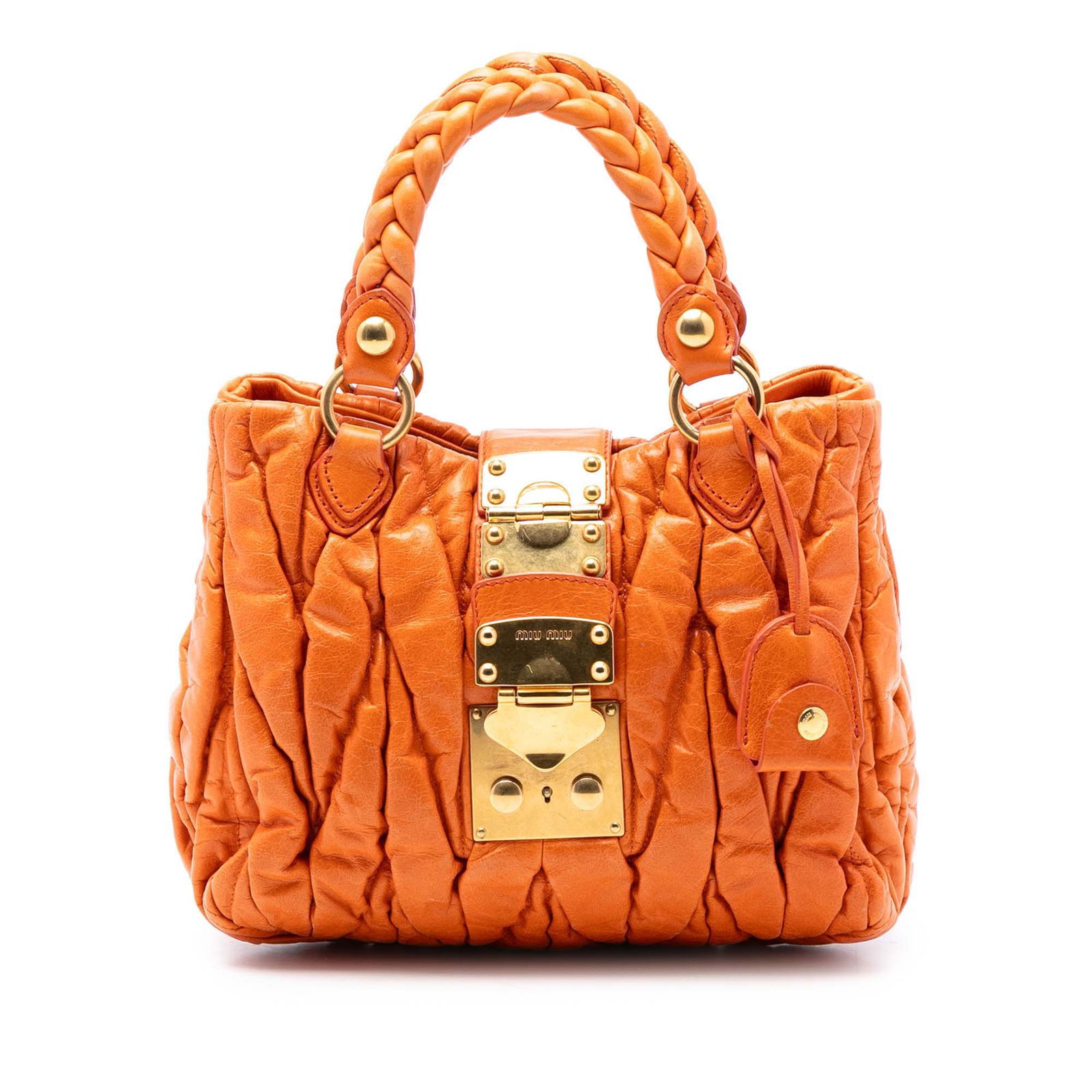 Miu Miu Coffer Satchel Orange Matelasse Lambskin Leather Handbag: Miu Miu Coffer Satchel Orange Matelasse Lambskin Leather Handbag This satchel showcases a gathered lambskin leather body with braided leather top handles and a detachable flat leather strap. It featur