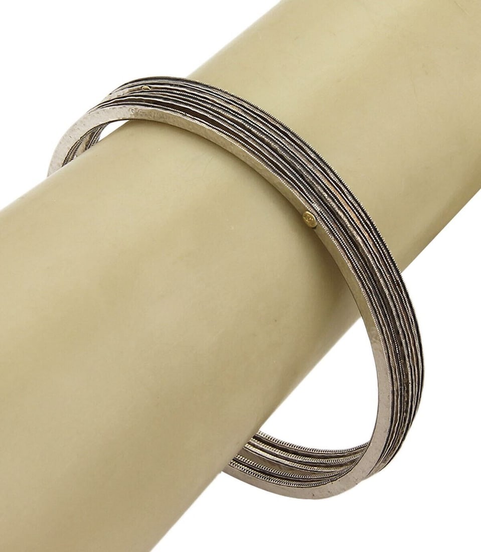 Set of 5 Hammered Sterling Silver 8.5 Inch Gurhan Vertex Bangles: Set of 5 Hammered Sterling Silver 8.5 Inch Gurhan Vertex Bangles This set includes five Gurhan Vertex bangle bracelets crafted from 925 sterling silver with a hammered finish. Each bracelet is signed