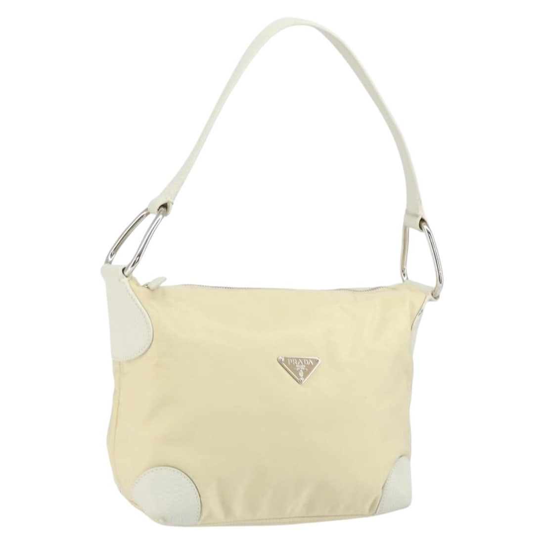 Prada Ivory Nylon and Leather Shoulder Purse with Silver Accents: Prada Ivory Nylon and Leather Shoulder Purse with Silver Accents This is an authentic Prada shoulder bag crafted from ivory nylon with silver-tone accents and leather details. The bag features a compa