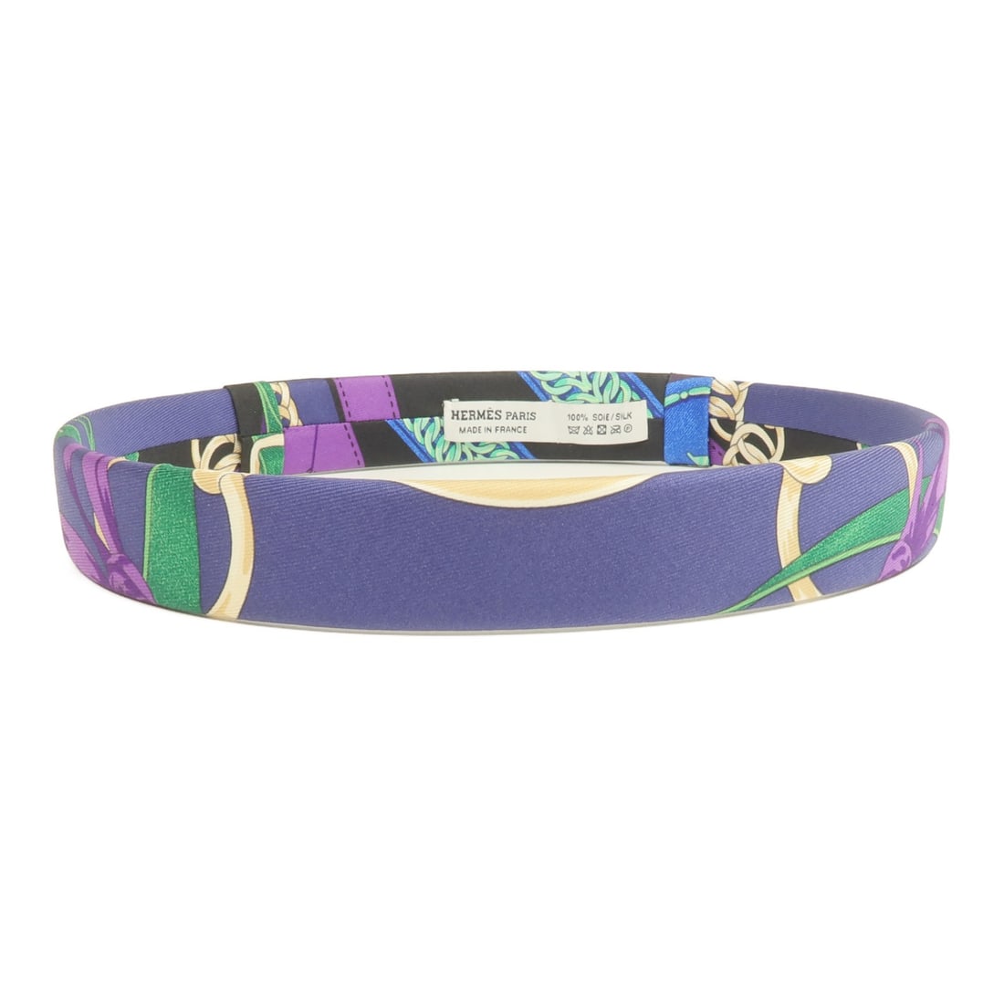 Silk Purple Hair Accessory from Hermes: Silk Purple Hair Accessory from Hermes This Hermes hair band is crafted from luxurious silk in a rich purple color. Made in France, it offers a stylish accessory for a sophisticated look. The hair ban